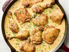 chicken thighs with gravy in a skillet