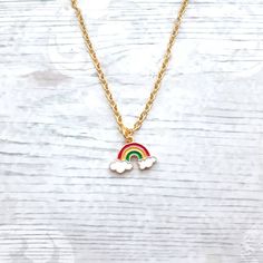 Super cute enamel rainbow charm necklace perfect for any rainbow lover. Great little birthday for family or friends. Would go perfect with matching items which can be found in my store. CHAIN LENGTH: *14inches perfect for children  *16inches perfect for children *18inches *20inches *22inches MARTERIALS: Chain, findings and charms and all gold plated *The enamel rainbow charm measures approximately 2cms long. * green, yellow, red * red, yellow, purple *These can also be personalised with initial charms which can be picked from the menu. The initial charms are gold plated and measure 1cm. ☆☆The necklace comes presented in a gift bag but boxes and gift wrapping can also be purchased from my store.☆☆ If you have any questions or custom orders please feel free to message me. Personalized Adjustable Rainbow Jewelry, Adjustable Personalized Rainbow Jewelry, Multicolor Hypoallergenic Necklace As A Gift, Multicolor Hypoallergenic Necklace For Gift, Hypoallergenic Multicolor Necklace Perfect As Gift, Hypoallergenic Multicolor Necklace For Gift, Rainbow Necklace With Adjustable Chain For Gift, Rainbow Nickel-free Jewelry For Gifts, Multicolor Charm Necklaces For Mother's Day Gift