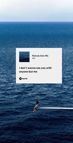 a person on a surfboard in the middle of the ocean with a message above them