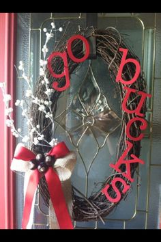 the front door is decorated with a wreath and red ribbon that says 99 cents on it