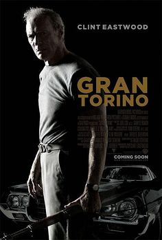 a man holding a baseball bat in front of a poster for the movie grant torino