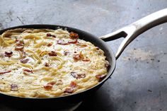 a skillet with some food inside of it