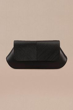 Black clutch in faux leather base with corded flap.
Composition: 100% PU/Faux Leather
Color: Black
Other Details: 
Dimensions (in inches): L x W x D: 10 x 1.8 x 4.5
 - Aza Fashions Rectangular Faux Leather Evening Clutch, Black Structured Shoulder Bag For Evening, Black Structured Evening Bag, Black Leather-lined Pouch Clutch, Modern Black Clutch In Soft Leather, Black Leather Pouch Clutch, Black Textured Leather Clutch For Everyday, Evening Structured Bags With Leather Lining, Structured Evening Bags With Leather Lining