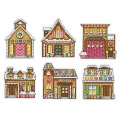 four cross stitch houses with candy on the windows and doors, all decorated in different colors