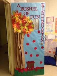 a bulletin board with flowers in a vase on it and the words bushel of fun