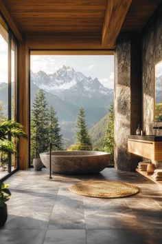 a bathroom with a large stone tub and mountain view