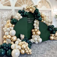 an arch made out of balloons and other decorations