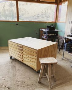 a workbench in a garage with lots of wood