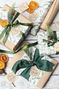 presents wrapped in brown paper with green ribbon and orange slices on them, sitting next to each other