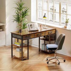 an office with a desk, chair and bookshelf next to a large window