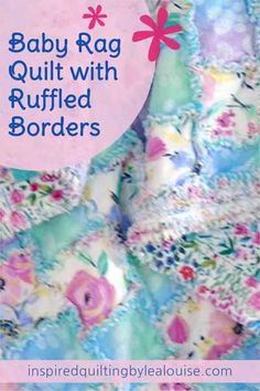 the baby rag quilt with ruffled borders is shown in pink, blue and green