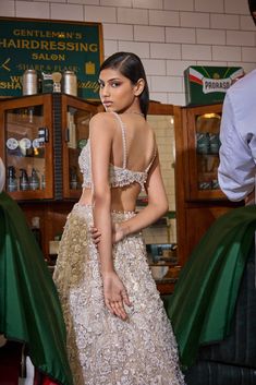 This lehenga set features all over three-dimensional embroidery in thread, pearl and sequin. The blouse is fully embroidered with a plunging neckline and shows pearl droplets at the waist. It is paired with a matching embroidered net dupatta.From Seema Gujral's For the love of London collection. DELIVERY TIMEPlease allow 8-12 weeks for your outfit to arrive. FABRIC DETAILSNet Professional cleaning only. Glamorous Organza Lehenga With Pearl Embroidery, Glamorous Festive Lehenga With Pearl Embroidery, Glamorous Choli With Pearl Embroidery For Receptions, Glamorous Pearl Embroidery Sets For Reception, Glamorous Lehenga With Pearl Embroidery For Party, Glamorous Pearl Embroidered Party Lehenga, Glamorous Party Lehenga With Pearl Embroidery, Glamorous Organza Sets With Pearl Embroidery, Festive Glamorous Choli With Pearl Embroidery