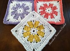 three crocheted squares with flowers on them