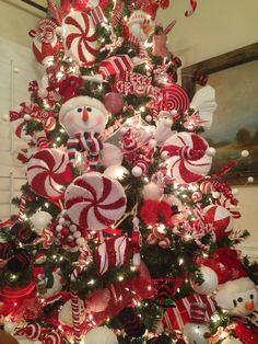 a christmas tree decorated with candy canes and snowmen