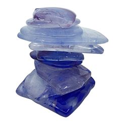 several pieces of blue glass stacked on top of each other