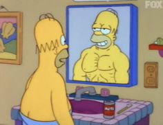 the simpsons is looking at himself in the mirror while he's getting ready to shave his hair