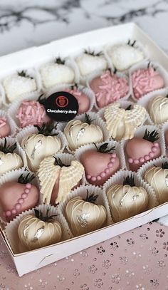 a box filled with assorted chocolates on top of a table