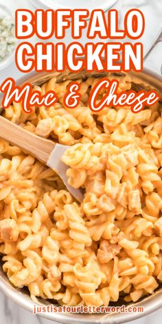 buffalo chicken macaroni and cheese in a pan with a wooden spoon