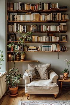 a living room filled with furniture and lots of books