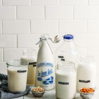 milk and cereal are sitting on the counter