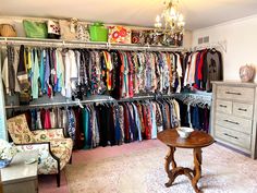 a room filled with lots of different colored clothes and furniture next to a white dresser