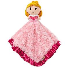 a stuffed doll in a pink dress on a white background