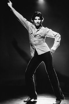 a man on a skateboard with his arms in the air