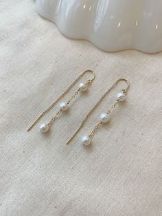 "These dainty Pearl threader earrings are classic and minimal. They look lovely paired with your special occasion outfits or a night out! The chain \"threads\" through the ear and stays in place!  Details: * Choose from 925 Sterling Silver or 14K Gold Filled * 5mm off round white Pearls * Approximately 2.25\" length * Made with all hypoallergenic materials 🤍 ✨ See all Pearl Jewelry here!: https://etsy.me/3zMbXyh WHAT TO KNOW ABOUT YOUR MAGBEE JEWELRY PURCHASE: 🤍 All MagBee pieces are safe for Dainty Chain Earrings, Elegant Simple Design Gold Earrings, Elegant Gold Earrings With Simple Design, Elegant Simple Gold Earrings, Delicate Linear Earrings For Anniversary, Minimalist 14k Gold Linear Earrings For Wedding, Minimalist 14k Gold Dangle Pearl Earrings, Minimalist Bridal Earrings For Anniversary, 14k Gold Minimalist Linear Earrings For Wedding