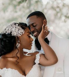 a bride and groom pose for a wedding photo