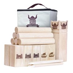 a wooden block set with four pieces of wood in front of it and a bag on the back