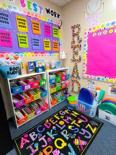 a colorful classroom with lots of toys on the floor and bulletin boards in the wall