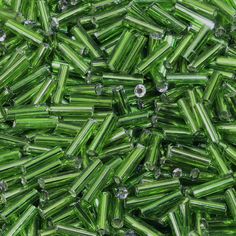 many green glass beads are scattered together