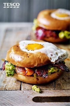 an egg in a hole with spicy bacon and guacamole on a bagel