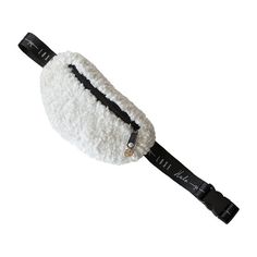 a white ball with black trim on it and a strap around the top of it