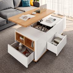 a living room with a couch, coffee table and bookshelf next to it