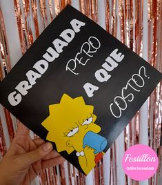 a person holding up a sign with the words graduation and homer simpson written on it