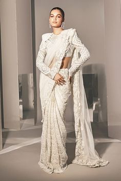 Ivory wave floral cutwork saree with crystal, bugle and thread embroidery. Paired with a full sleeve cutwork embroidered blouse and petticoat. - Aza Fashions Elegant White Designer Pre-draped Saree, Elegant Chikankari Pre-draped Saree For Reception, Festive Pre-draped Saree With Lace Work For Designer Wear, Traditional Designer Pre-draped Saree With Lace Work, Elegant White Pre-draped Saree For Eid, Elegant White Pre-draped Saree With Pallu, Bollywood Style Georgette Pre-draped Saree With Lace Work, Elegant White Pre-draped Saree With Sheer Dupatta, Elegant Lace Pre-draped Saree With Zari Work