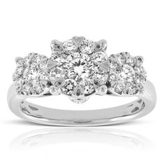 a white gold ring with three diamonds on it