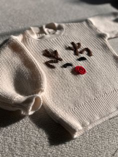 ✿ Welcome to MinimaKids ✿ How to order: 1. Please select the sweater color from the options. 2. Please select the size from the options. 3. Then, add to cart to complete your order. Looking for the perfect Christmas gift for your little one? Look no further! This adorable baby sweater combines festive cheer and cozy warmth in one delightful package. Featuring a charming design, this sweater is an ideal choice for those seeking a unique and thoughtful holiday gift. Our newborn baby sweaters are also a popular choice for baby shower gifts, adding both practicality and sentimental value. Crafted as a knitted baby outfit, this sweater is gentle on your baby's delicate skin, thanks to its soft texture. Plus, it comes with a GOTS (Global Organic Textile Standard) certificate, ensuring it's made Baby Christmas Sweater, Christmas Baby Clothes, My First Christmas Outfit, First Christmas Outfit, Baby Boy Christmas Outfit, Boys Christmas Outfits, Baby Boy Christmas, Pull Bebe, Christmas Knitting Patterns