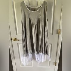 a dress hanging on a door hanger