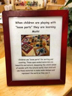 a wooden frame with a poem about children's playing with loose parts they are learning