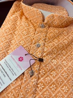 Peach Color Chikankari Work Men's Kurta Pajama Set with full Lucknowi embroidery work on the Kurta on the Front and back side of the Kurta. Kurta comes with a Soft Lining paired with white color cotton bottom/pajama. Kurta is Fully Lined. Very trendy and Classy Looking Mens Wear. Item : Men's Kurta PajamaReady to Wear : YesKurta Color : PeachPajama Color : White (Cotton)Fabric : Georgette Pocket : YesWork : Chikhenkari Embroidery, Fancy ButtonsDisclaimer-For sizing please refer to the Size Chart Designer Orange Kurta With Chikankari Embroidery, Orange Chikankari Embroidery Kurta For Diwali, Traditional Diwali Sherwani With Chikankari Embroidery, Orange Traditional Wear With Chikankari Embroidery For Eid, Traditional Orange Kurta With Self Design, Lucknowi Embroidery, Men's Kurta Pajama, Mens Ethnic Wear, Chikankari Work