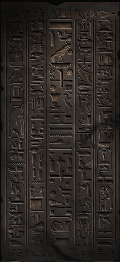 an egyptian hieroglyphical type of writing on black paper with arabic and english characters