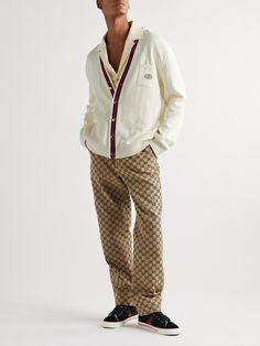 Gucci's cardigan is trimmed with red and navy stripes, a nod to its signature equestrian-inspired webbing. Appliquéd with a 'GG' logo at the chest pocket, it's been rib-knitted in Italy from soft cotton and has dropped shoulder seams for a relaxed fit. Luxury Men's Button-up Cardigan, Gucci Shirt Outfit, Gucci Outfit Men, Gucci Sneakers Outfit, Gucci Cardigan, Couples Clothes, Gucci Outfit, Preppy Man, Cardigan For Men