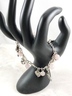 This fun, Aphrodite themed, charm bracelet is the perfect accessory to showcase your love for the Greek myths in a subtle way. Aphrodite is the Greek goddess of love and beauty. Charms included: Heart - to symbolize love Swan - her sacred animal Apple - often associated with the goddess Dove - Aphrodite's sacred bird Eros/Cupid - her son Rose - one of her symbols Mirror- to symbolize beauty Clam Shell - to symbolize her birth 8 beads are also included in between each charm. Your choice between r Spiritual Charm Bracelet For Friendship, Venus Jewelry, Venus Goddess, Greek Mythology Jewelry, Mythology Jewelry, Goddess Jewelry, Rose Quartz Bracelet, Goddess Of Love, Rose Quartz Beads