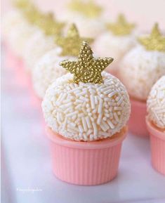 small cupcakes decorated with gold stars and sprinkles