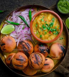 a plate with some food on it and the words, little chokha in front of it