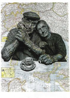 two people sitting at a table in front of a map with a cup and saucer