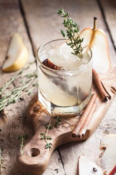 an apple cider is garnished with rosemary