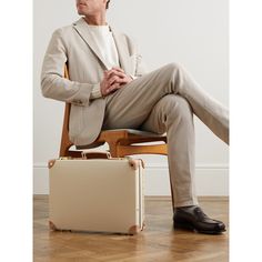 Globe-Trotter's attaché case pays homage to the 1920s era of exploration. Reinforced with leather trims and finished with gold-tone hardware, it's made from the label's signature vulcanised fibreboard that's designed to stand the test of time. The streamlined silhouette and smart materials will elevate your every travel outfit. Vintage Formal Briefcase With Gold-tone Hardware, Classic Briefcase With Gold-tone Hardware, Vintage Briefcase With Gold-tone Hardware For Travel, Classic Formal Briefcase With Leather Trim, Rectangular Briefcase With Leather Trim For Formal Use, Classic Rectangular Briefcase With Leather Trim, Designer Beige Briefcase For Travel, Classic Briefcase With Gold-tone Hardware For Business Trips, Designer Formal Briefcase With Leather Trim